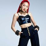 **Prompt:** Sammi Cheng in a bold 90s fashion ensemble: high-waisted pants, crop top, and statement accessories. Capture her confident pose and vibrant energy reflecting her trendsetting style.